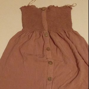 Dress off sholder with buttons ruffles at top.